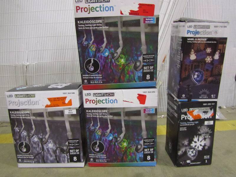 lot 25 image: LightShow LED Projection Whirl-a-Motion-Snowman stake White Snowflake Projection Spotlight Stake 8-Light Multi-Color Round Projection String Lights (quantity of 2) LightShow 8-Light White Projection Round String Lights