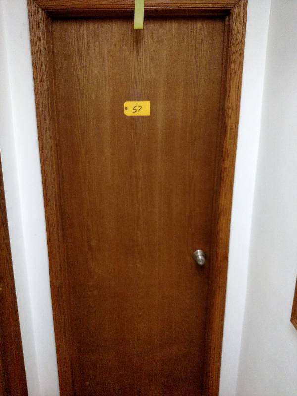 lot 57 image: 30 Oak Door with Frame & Trim on O...