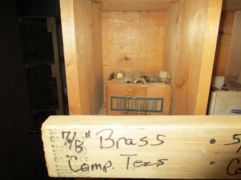 lot 121 image: 18x6x1 Wooden Wall Organizer  Contents of Copper fittings