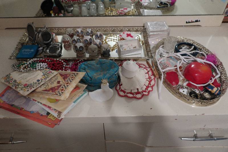 CONTENTS ON TOP OF DRESSER -  PORCELAIN OWLS, JEWELRY, ECT
