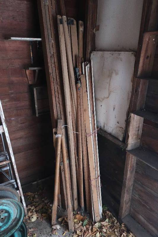 CORNER LOT OF WOOD TRIPODS WITH SPIKES AND NAILS