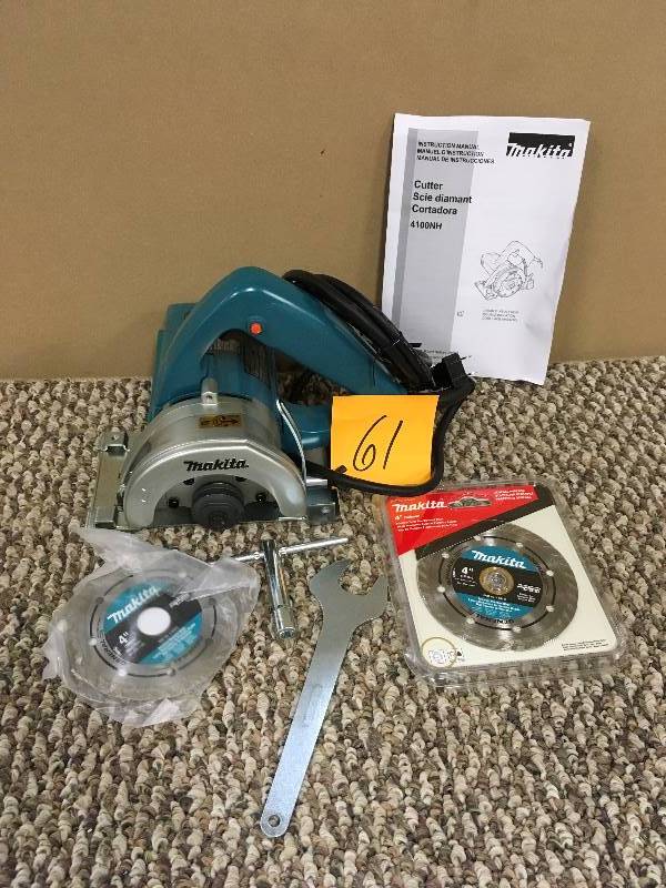 lot 61 image: Makita 4-38 Masonry Saw includes Extra 4 Diamond Blade - Open Box never used