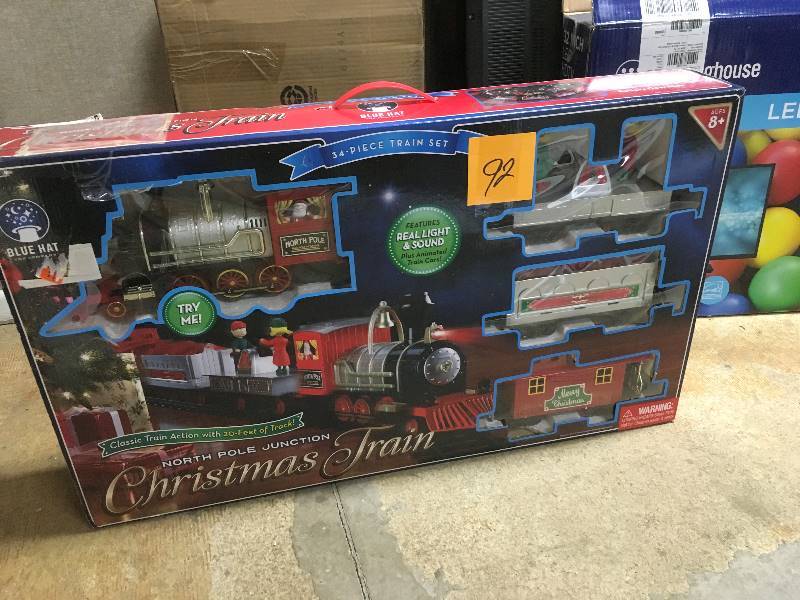lot 92 image: Blue Hat Toy Company North Pole Junction Christmass Train Set - Open Box Never Used