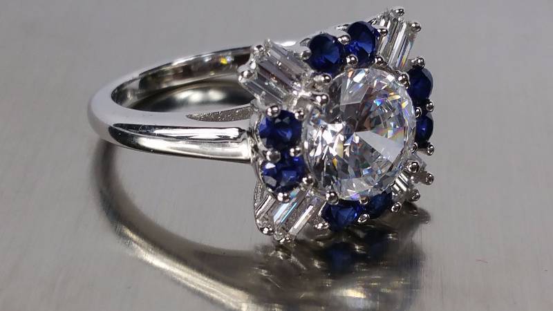 lot 62 image: White and Blue Sapphire Ring