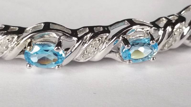 lot 149 image: Blue Topaz and Diamond Bracelet