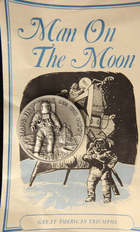 lot 37 image: VINTAGE MAN ON THE MOON 1.15 TROY OZ. STERLING SILVER ART ROUND LONGINES SYMPHONETTE SOCIETY