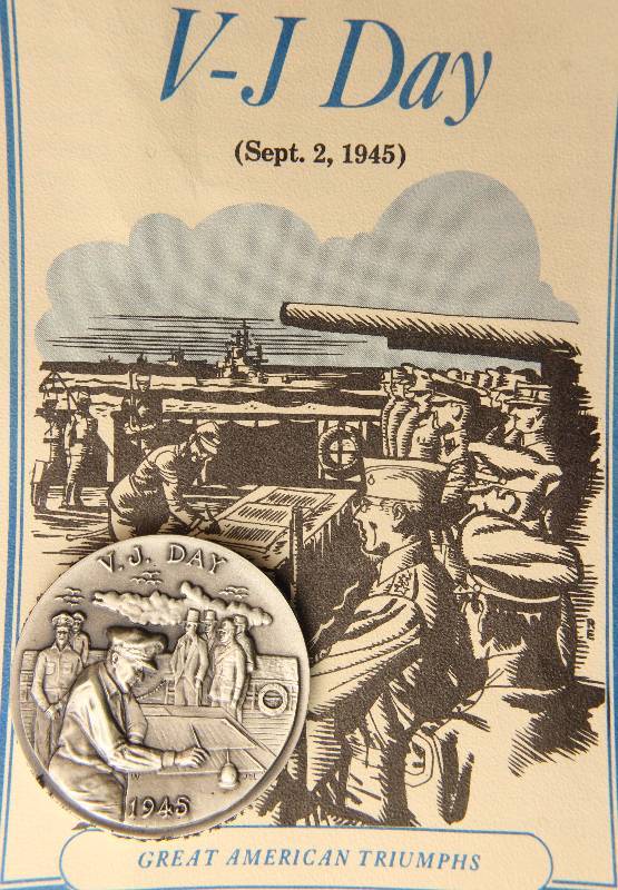 lot 86 image: VINTAGE V-J DAY 1.15 TROY OZ. STERLING SILVER ART ROUND LONGINES SYMPHONETTE SOCIETY