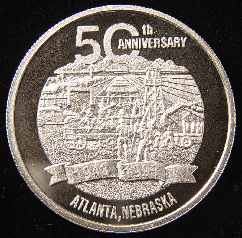 lot 77 image: 1 TROY OZ. .999 FINE SILVER CAMP ATLANTA GERMAN POW ANNIVERSARY ROUND