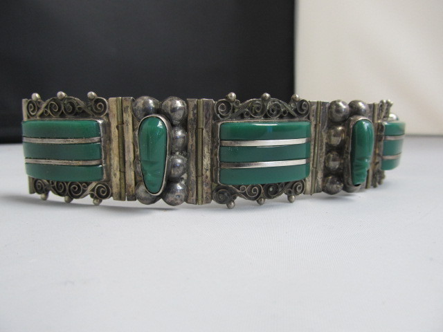 lot 110 image: Heavy Vintage Sterling Silver & Carved Onyx Bracelet