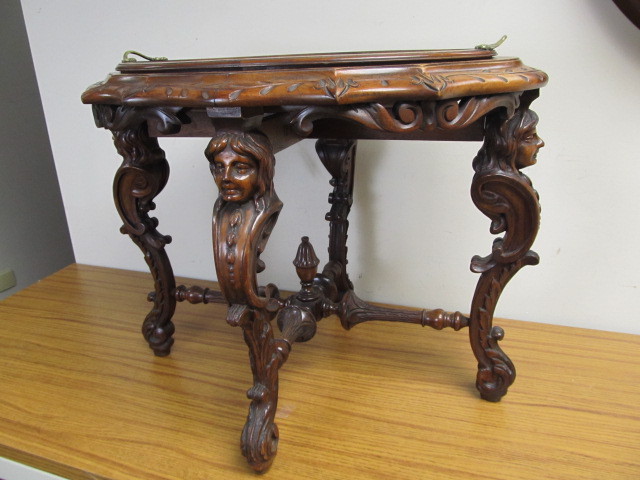 lot 16 image: Antique Victorian Ornately Carved Figural Oval Cocktail Table