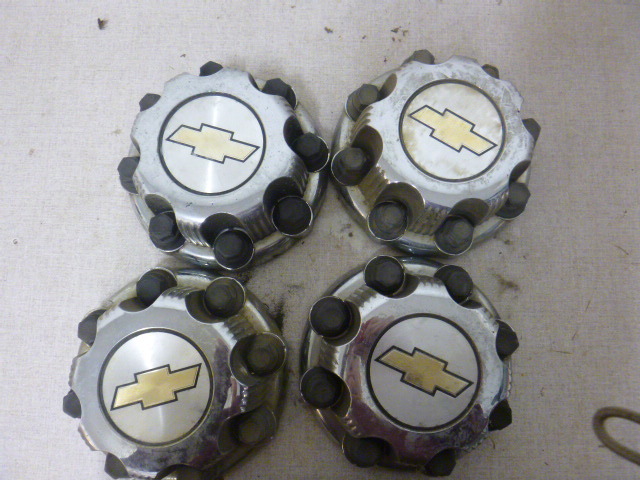 lot 103 image: Chevy Hub Caps