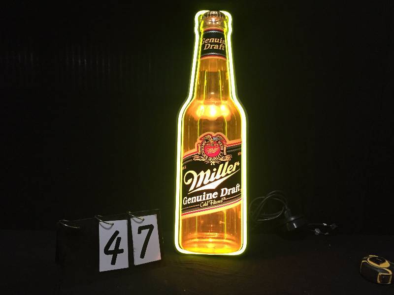 lot 47 image: Miller Genuine Draft light up bottle with neon border tube