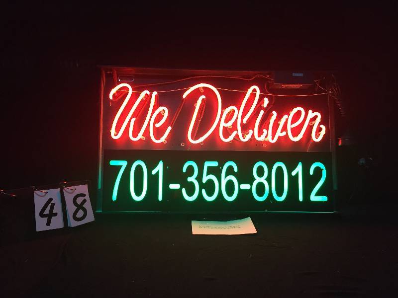 lot 48 image: We Deliver neon