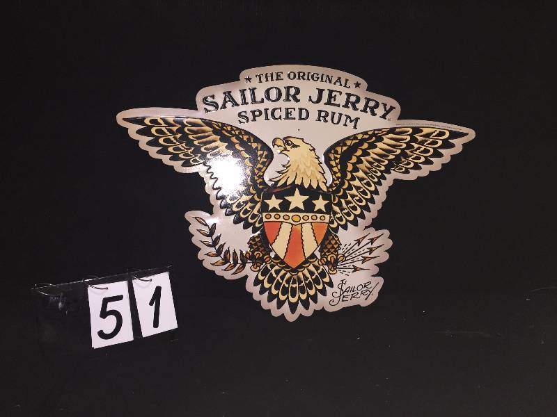 lot 51 image: Sailor Jerry spiced rum embossed tin sign