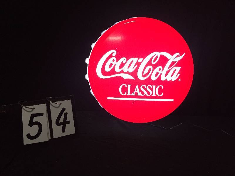 lot 54 image: Coca-Cola Classic light up bottle cap