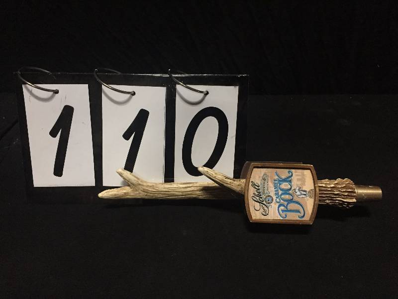 lot 110 image: Schell Brewing buck antler tap handle