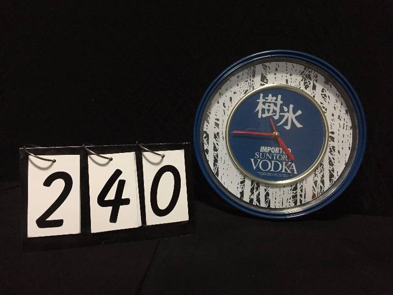 lot 240 image: Suntory Vodka clock
