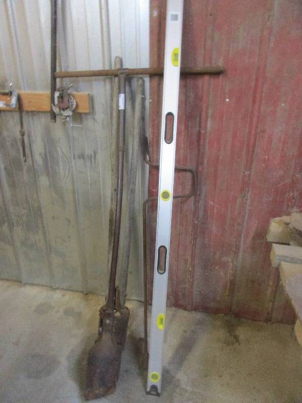Post hole diggers and level