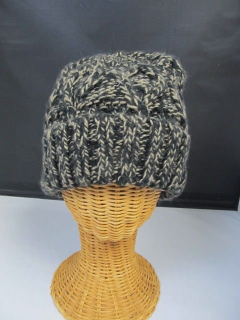 lot 65 image: Knitted Black & Tan Winter Skull Hat