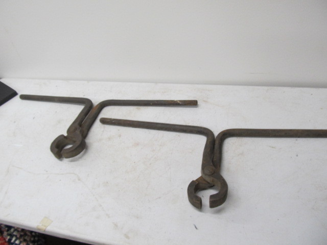 lot 141 image: Pair of Antique Cast Iron CSTPM&ampO Railroad Track Carrying Tools