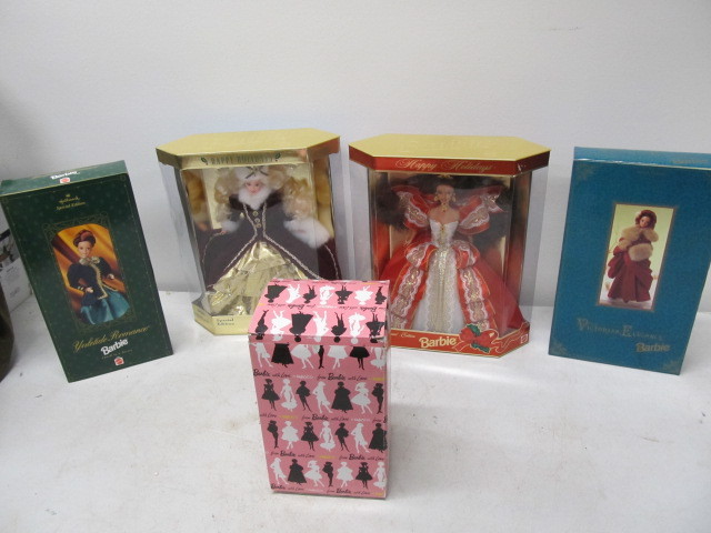 lot 270 image: Group of MINT IN BOX Holiday Barbies