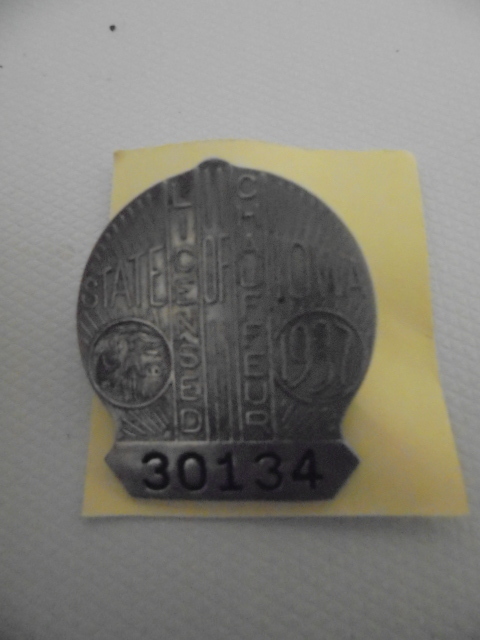 lot 45 image: Antique Iowa Chauffeur License Pins