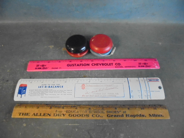 lot 47 image: Vintage YoYos and Rulers