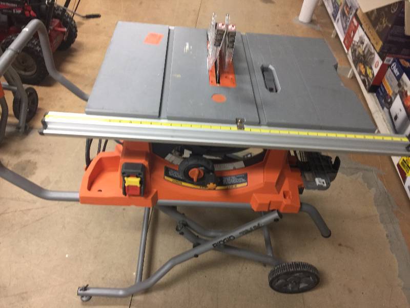 lot 149 image: RIDGID 15 Amp 10 in. Heavy-Duty Portable Table Saw with Stand Model#  R4513 in good working conditions
