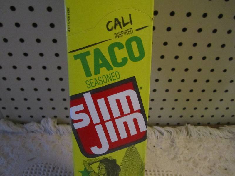 lot 148 image: Box of 24 Slim Jim Sticks Taco Seas...