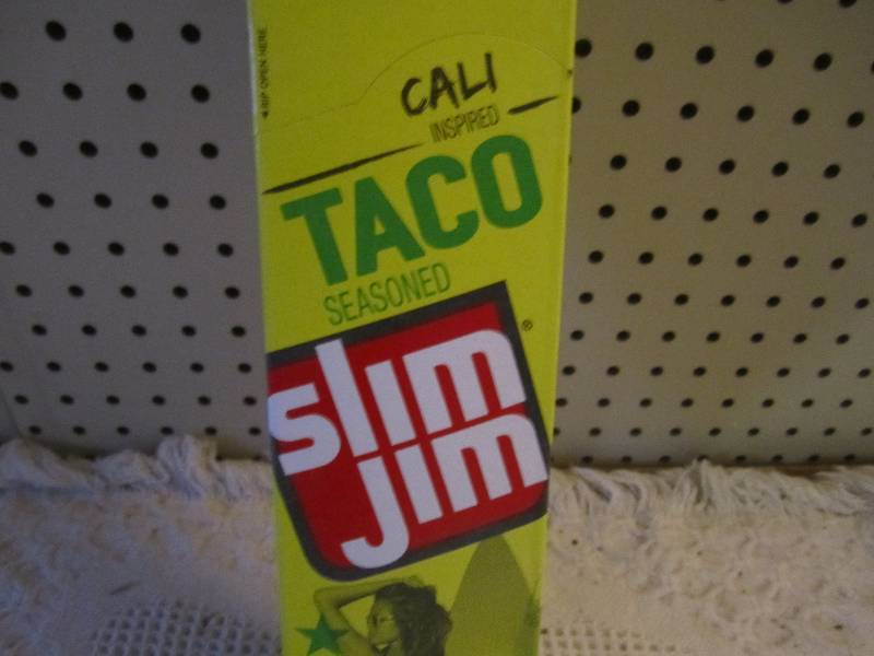 lot 150 image: Box of 24 Slim Jim Sticks Taco Seas...