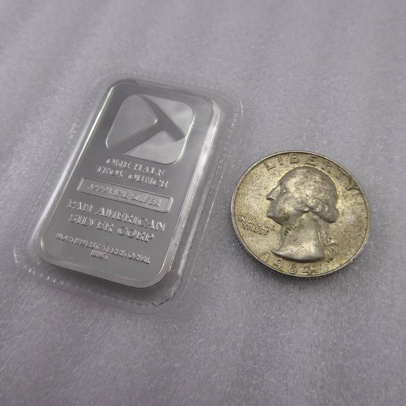 lot 67 image: 1964 Washington Quarter & 12 Ounce Sealed Silver Bar Lot