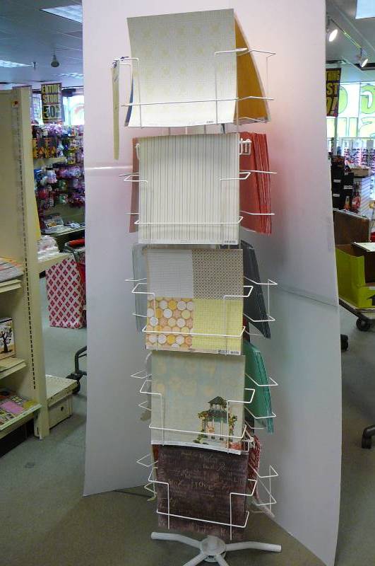 lot 37 image: Scrap book paper with Spinner Rack