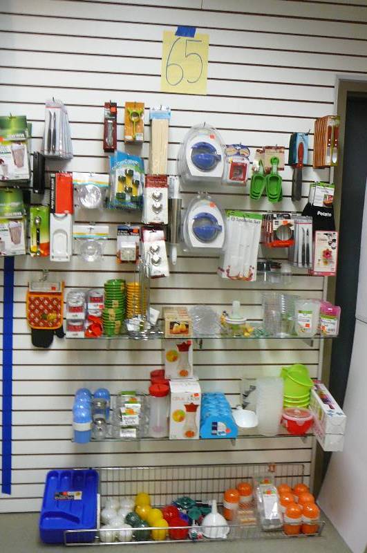 lot 65 image: Silverware trays. Measuring cups, butter dishes rooster timers. Tea Infusers. Napkin Holders. Spatulas. Juicer, Kitchen Items approx. 140 plus items