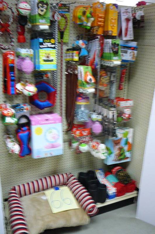 lot 66 image: Dog bowls, Blanket, Collars, Squeaky dog toys, dog bed, Misc. pet items Approx. 100 items