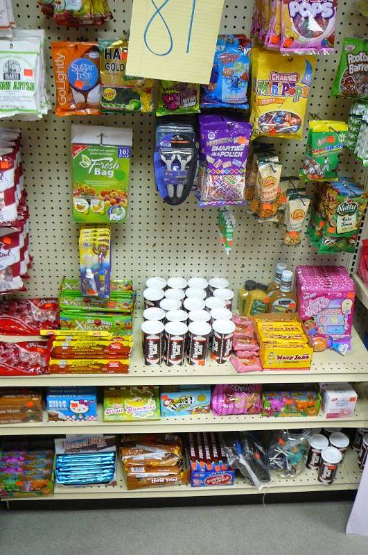 lot 81 image: Toothbrushes, Shopping bags, Boxes of soap, Candy, Shavers, Fresh bag Approx. 90 items