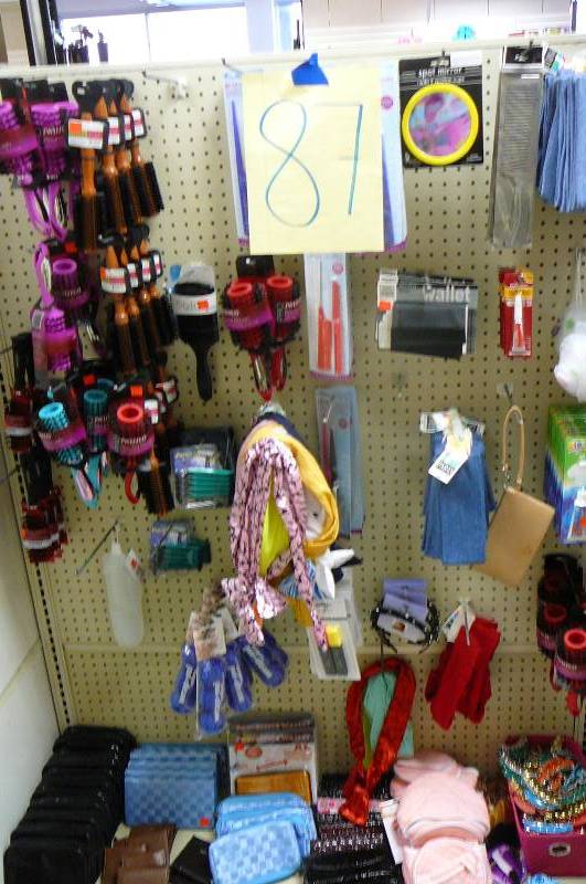 lot 87 image: Hair Products & Bags, Hair Brushes ( 30 Plus ), Curlers, Makeup Bags, Aluminum Wallet