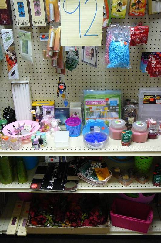 lot 92 image: Lot of Misc. Items Crinkled Shred Filler, Fake Flowers, Storage Containers, Tea Lights, Scented Oil