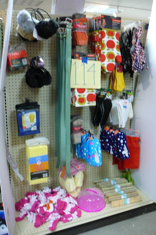 lot 114 image: Slippers, Socks. ear muffs Belts, Bamboo Placemats