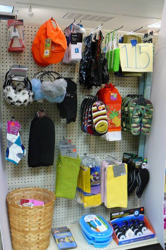lot 115 image: Belts. Socks. Kitchen towels. Ski mask. Hanging light