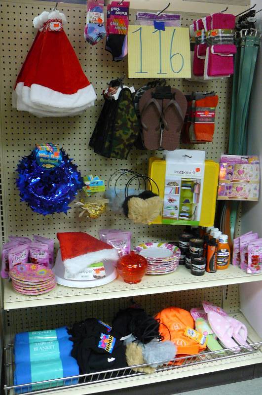 lot 116 image: Santa hat. Blanket throw, Womens Slippers. Hanging closets organizer