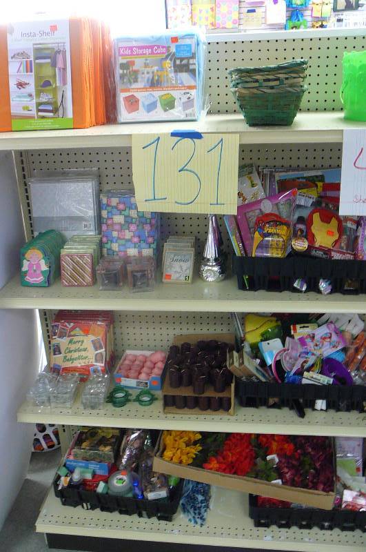 lot 131 image: Storage cubes, Votive candles and candle holders, Stationary, Baskets, Assorted Childrens stickers, Artificial Flowers, Lot of gift bags