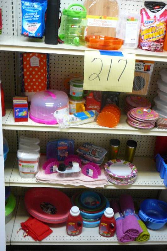 lot 217 image: Beach towels, Football koozies, Jumbo plastic serving bowls, Laundry detergent