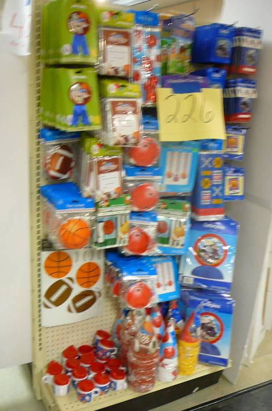 lot 226 image: Party Supplies, Sports, Buttons, Garland, Thank you, Hats, Dcor, Candles train, Treat bags, Sippy Cups  Approx. 340 items