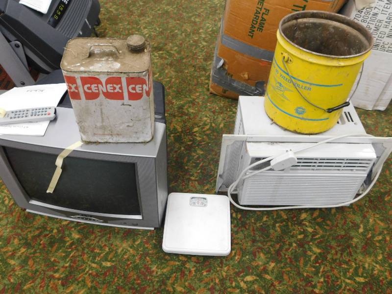 lot 63 image: SMALL TV WITH REMOTE, WINDOW AIR CONDITIONER, OLD CENEX CAN AND WEED KILLER CAN