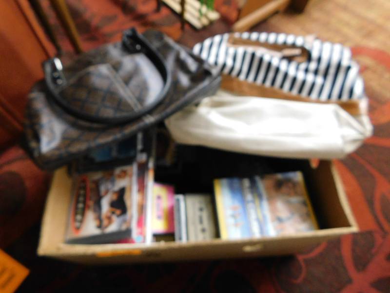 lot 132 image: DVD MOVIES AND  PURSES