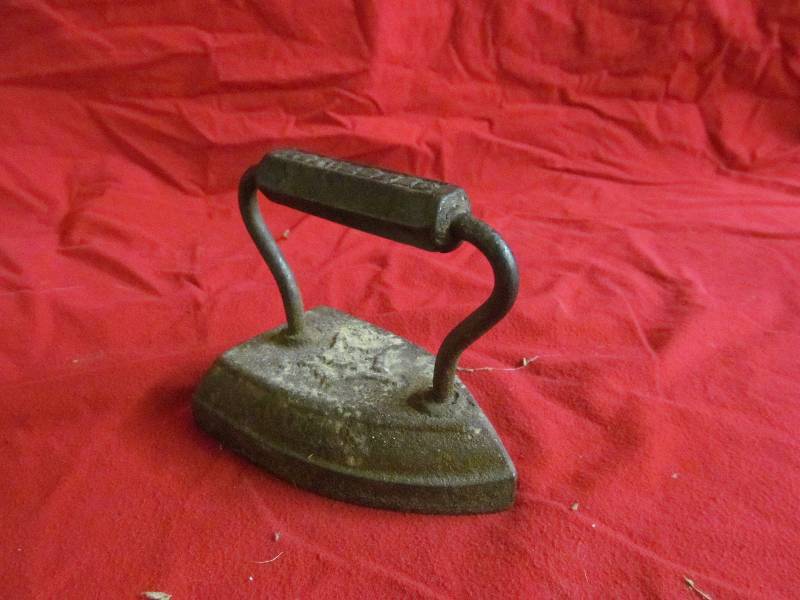 lot 63 image: Vintage sad iron