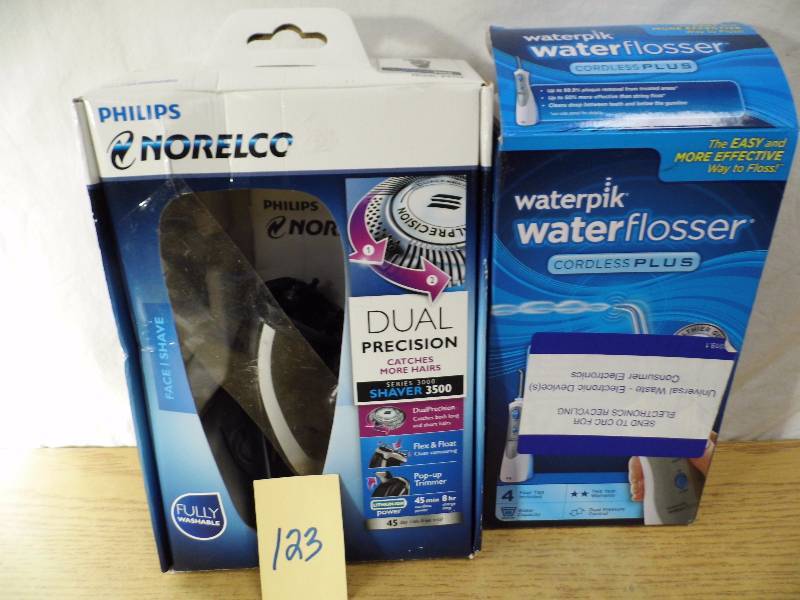 lot 123 image: Store Return - Norelco Razor - Flosser