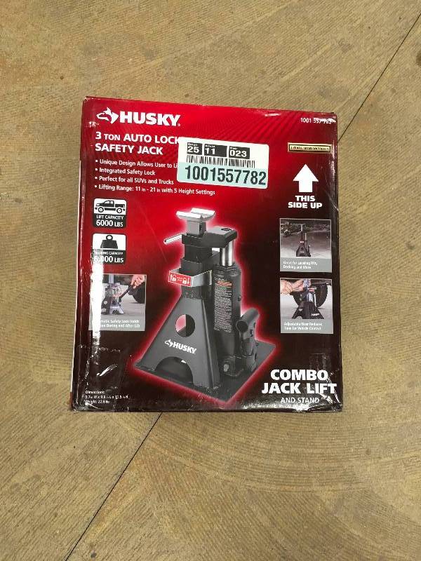 lot 12 image: Husky 3 Ton Auto Locking Safety Jack not used 600 Lbs Capacity