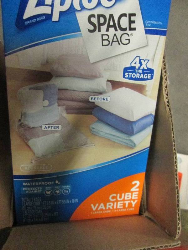 9 boxes of ziploc space bags open b...