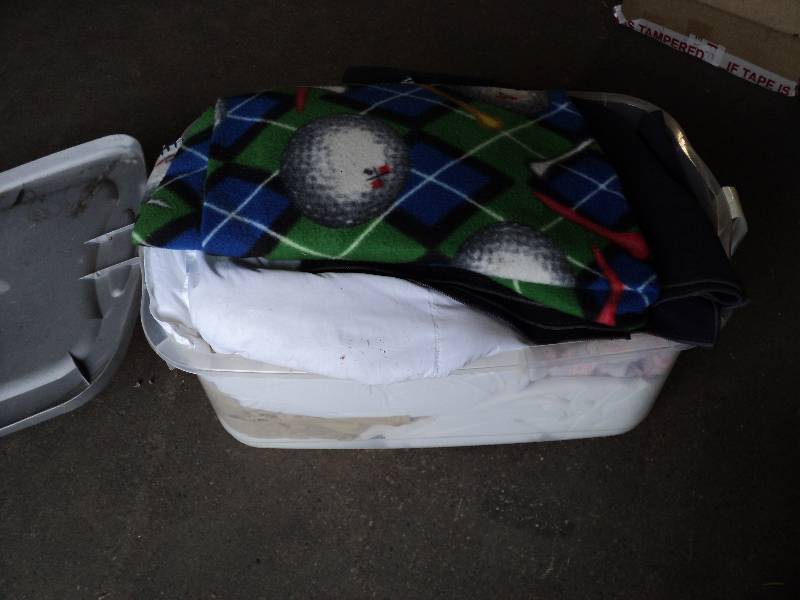 lot 56 image: tote of sheets, blankets, and potte...